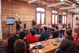 A co-working space with someone presenting to a group